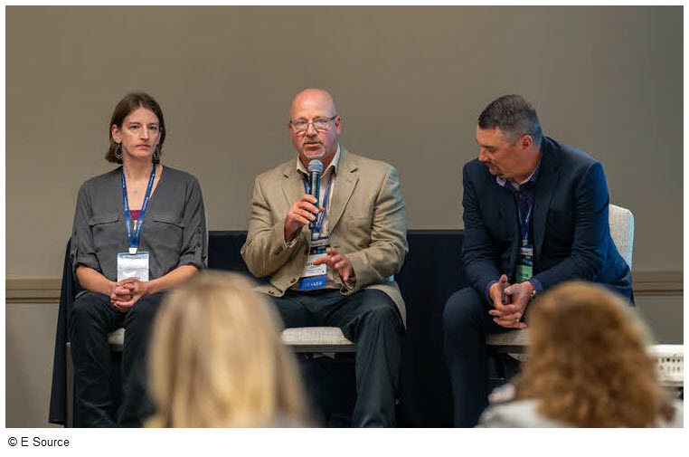 Award winners sit on a panel during a Forum session